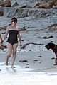 milla jovovich puts her baby bump on display in a bathing suit 01