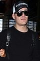 paris hilton cozies up to fiance chris zylka jetting out of lax 04