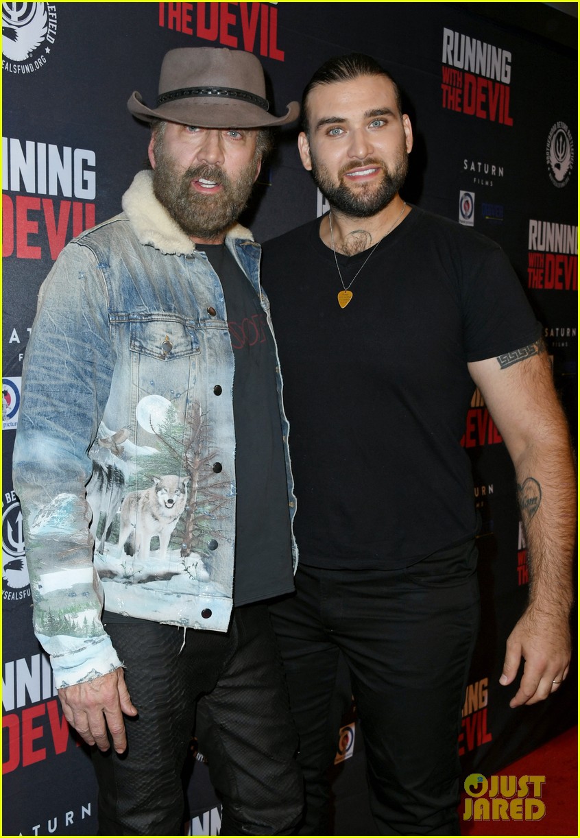 nicolas cage gets support son weston at running with the devil premiere 044354094