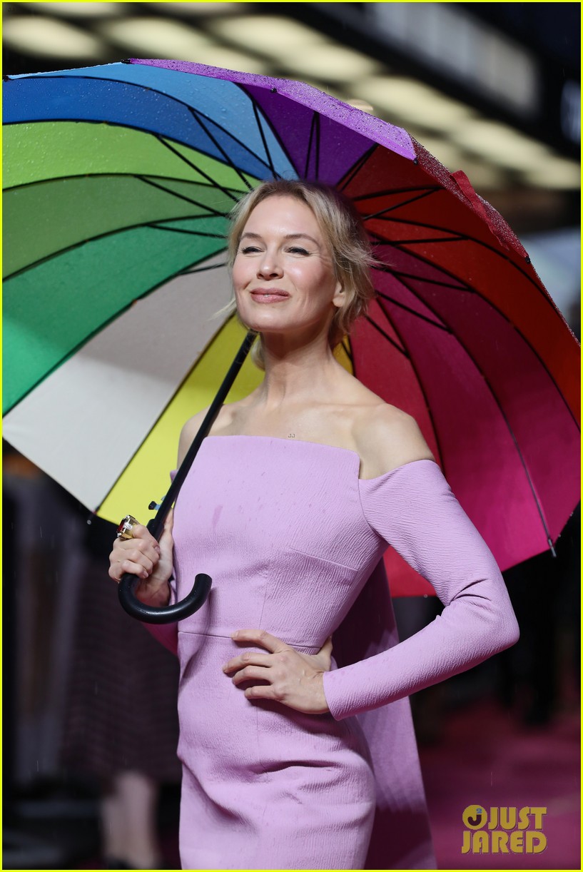 renee zellweger keeps dry with umbrella at judy european premiere 104362771