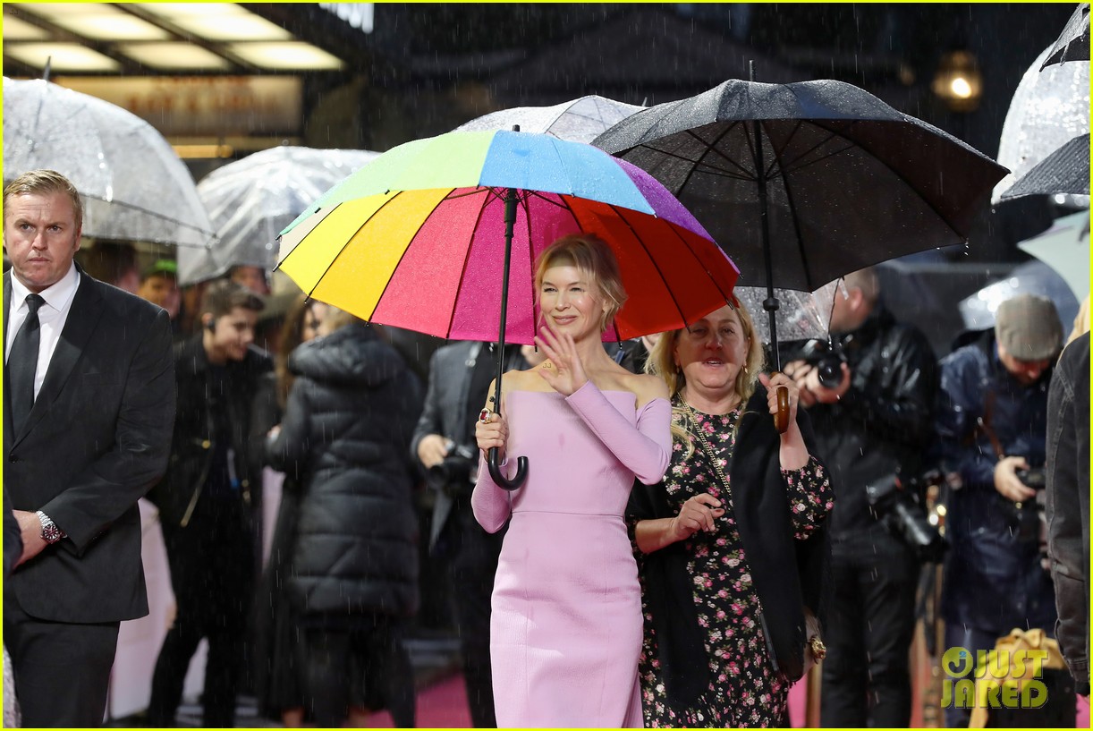 renee zellweger keeps dry with umbrella at judy european premiere 124362773