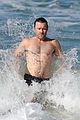 joel edgerton goes for a dip in the ocean 04