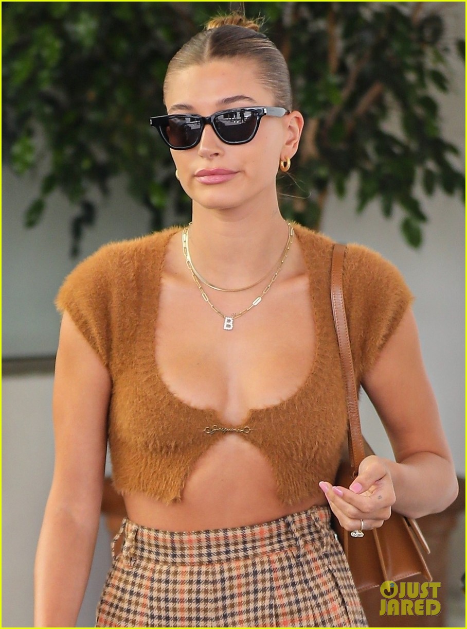 hailey bieber shows off fit figure in crop top sweater plaid pants 014583689