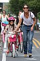 katie holmes teaches suri cruise to ride a bike 01