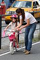 katie holmes teaches suri cruise to ride a bike 05