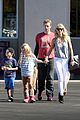 gwyneth paltrow chris martin toys r us with the kids 01