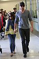 lea michele cory monteith holding hands at lax 05