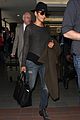 halle berry covers baby bump at lax 03