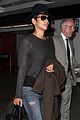 halle berry covers baby bump at lax 04