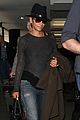 halle berry covers baby bump at lax 08