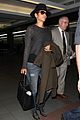 halle berry covers baby bump at lax 11