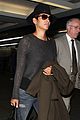 halle berry covers baby bump at lax 12