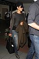 halle berry covers baby bump at lax 13