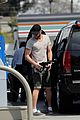liam chris hemsworth filling up on gas groceries 08