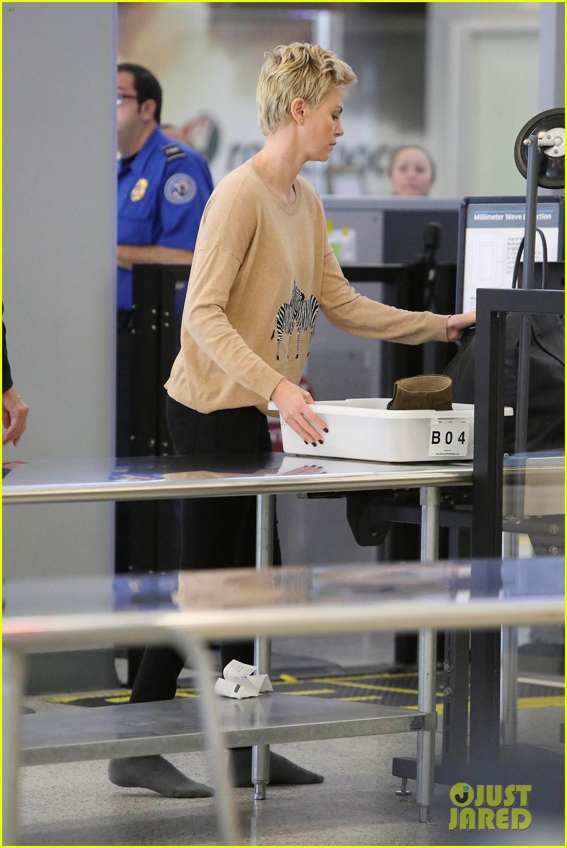 charlize theron zebra sweater at the airport 08