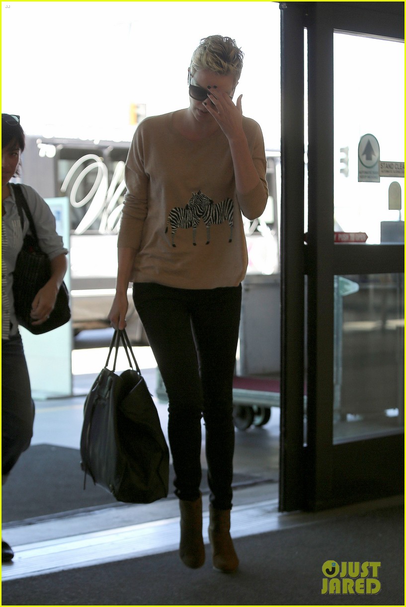 charlize theron zebra sweater at the airport 212852164