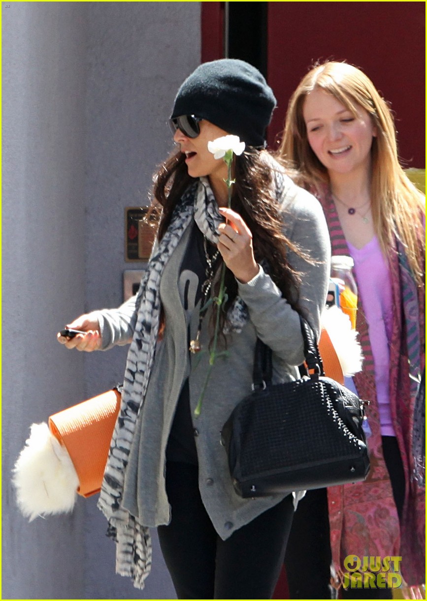 demi lovato carries a white rose out of yoga class 02