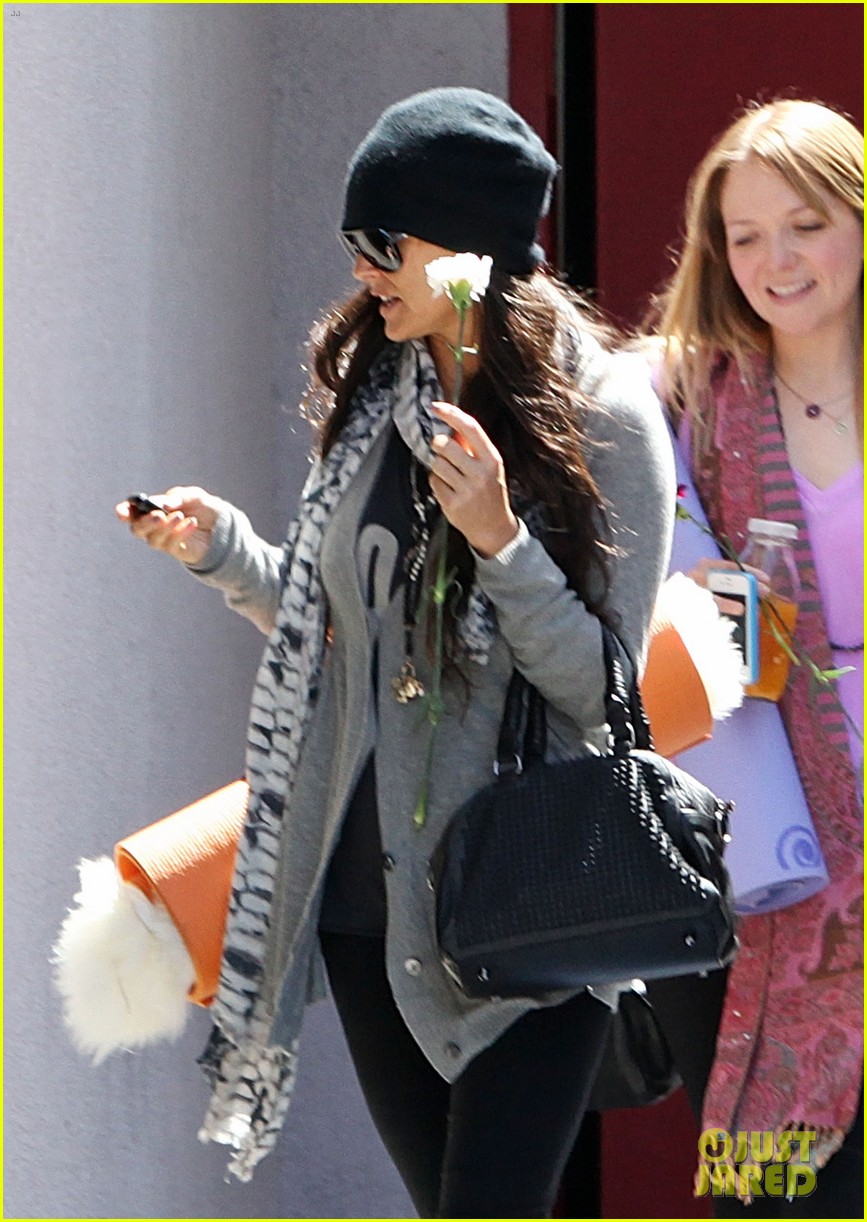 demi lovato carries a white rose out of yoga class 10