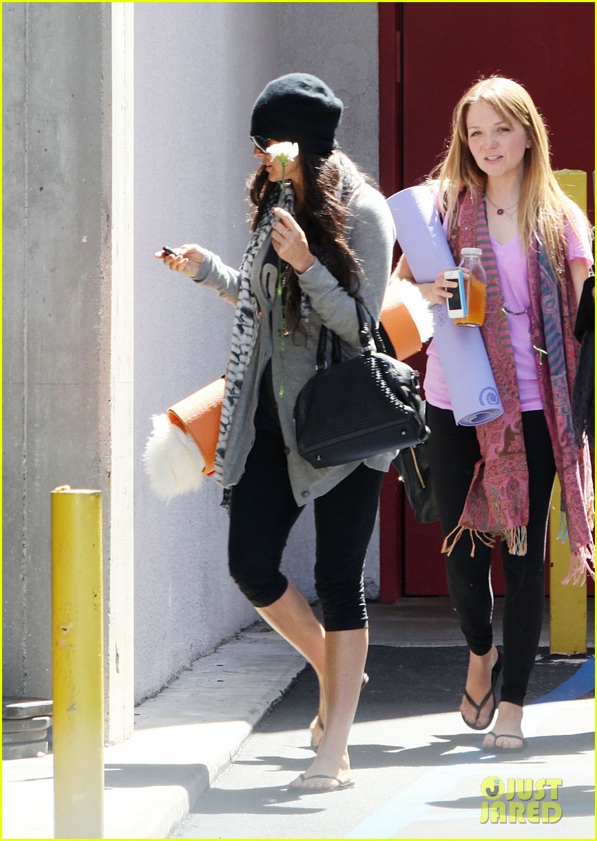 demi lovato carries a white rose out of yoga class 112868998