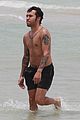pete wentz shirtless beach day with bronx meagan camper 06