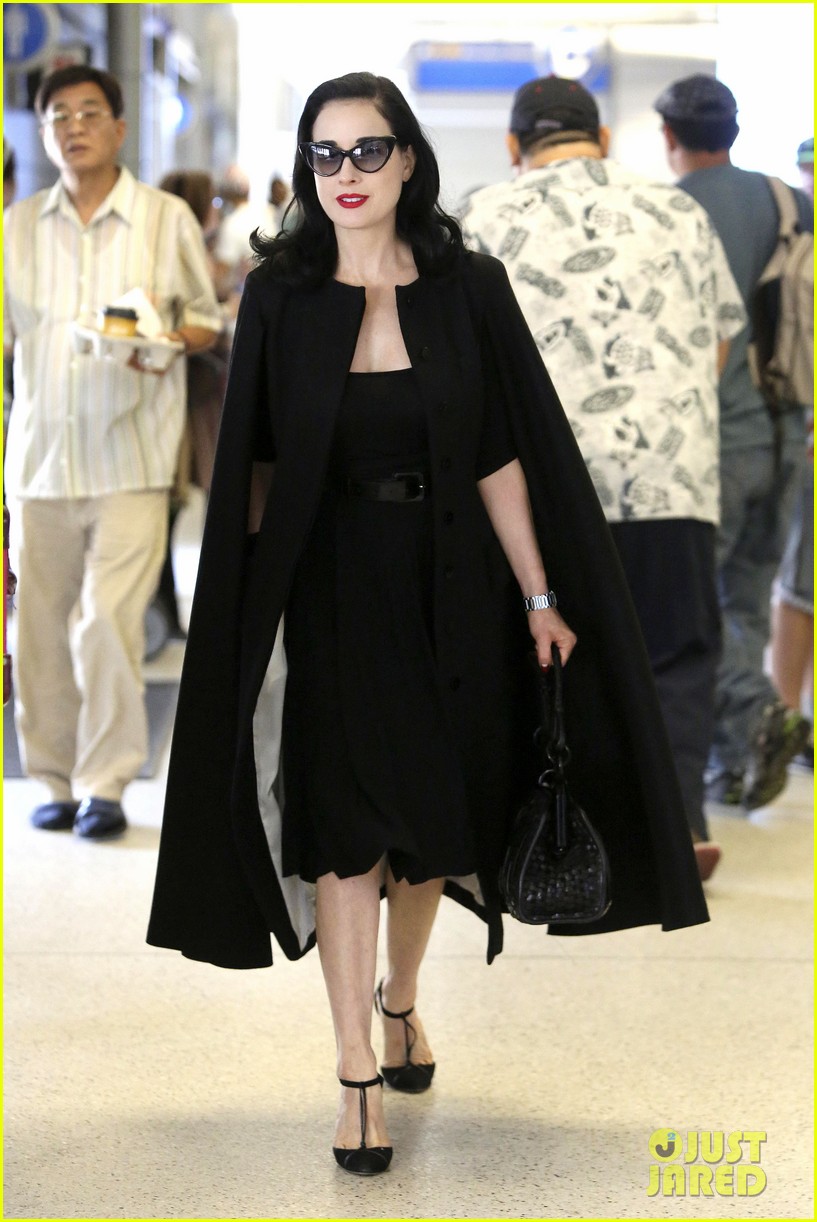 dita von teese wears cape for flight to buenos aires 03
