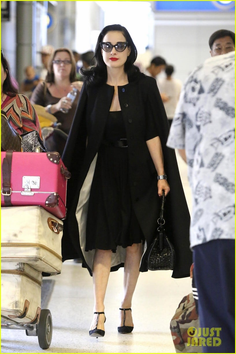 dita von teese wears cape for flight to buenos aires 06
