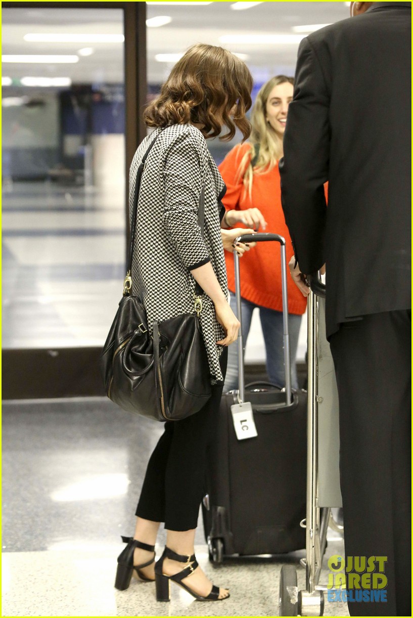 lily collins pushes giant luggage cart after mortals tour 272939628