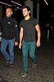 taylor lautner flies without marie avgeropoulos 11