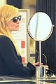 kirsten dunst shops for new sunglasses in nyc 06