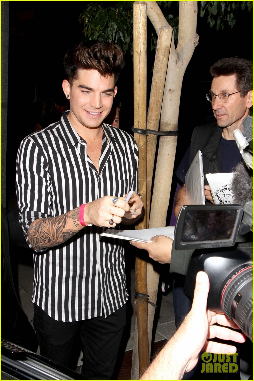 adam lambert smiles wide while heading to bootsy bellows 022961812