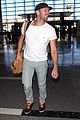 chris martin catches flight out of los angeles 05