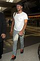 chris martin catches flight out of los angeles 08