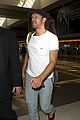 chris martin catches flight out of los angeles 09