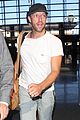 chris martin catches flight out of los angeles 11
