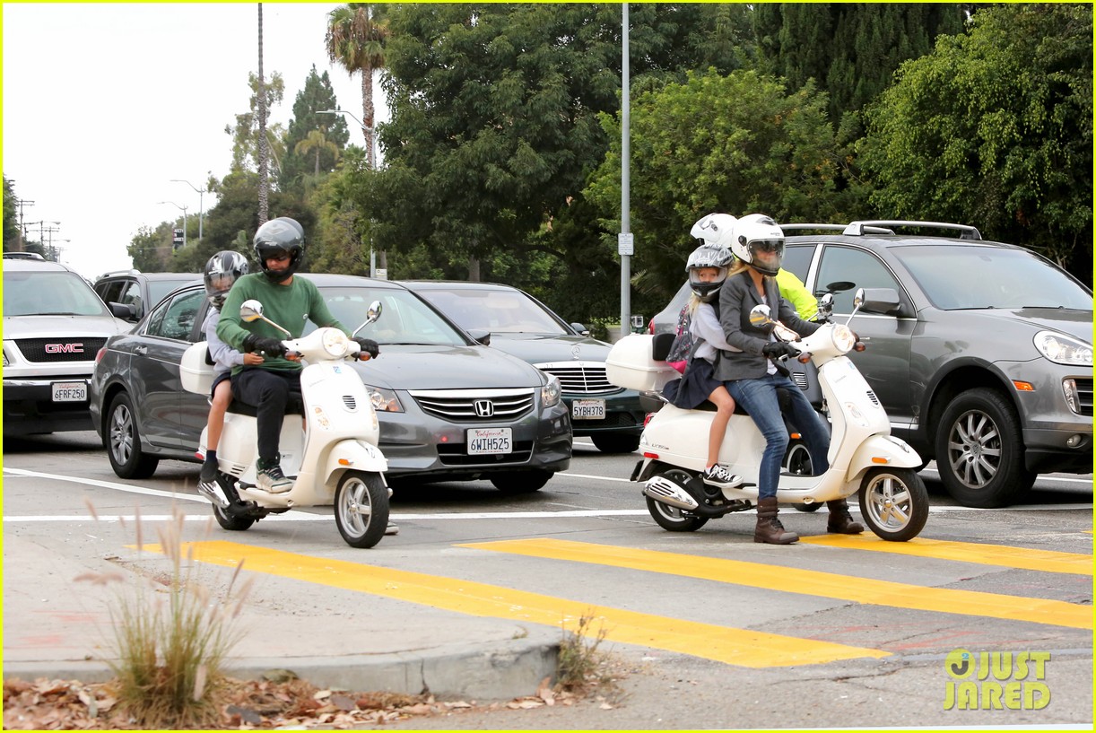 gwyneth paltrow chris martin side by side scooter rides 022950236
