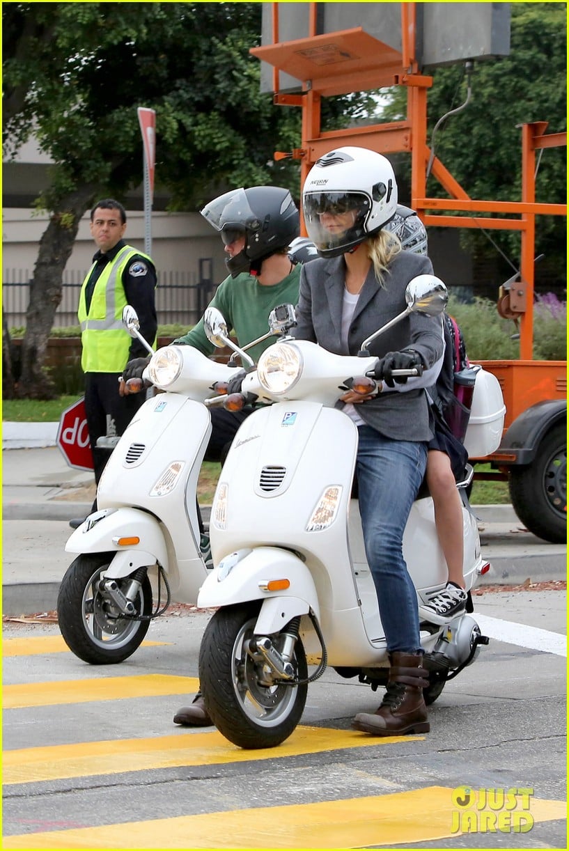 gwyneth paltrow chris martin side by side scooter rides 04