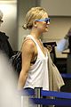 kate hudson flashes bra at the airport 02