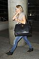 kate hudson flashes bra at the airport 03