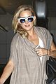 kate hudson flashes bra at the airport 04