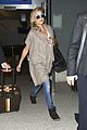 kate hudson flashes bra at the airport 08