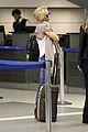 kate hudson flashes bra at the airport 11
