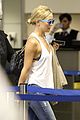 kate hudson flashes bra at the airport 12