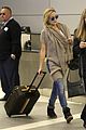 kate hudson flashes bra at the airport 13