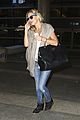 kate hudson flashes bra at the airport 14