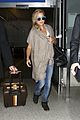 kate hudson flashes bra at the airport 18