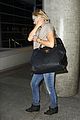 kate hudson flashes bra at the airport 23
