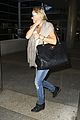 kate hudson flashes bra at the airport 24