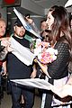 lana del rey receives flowers at lax airport 08