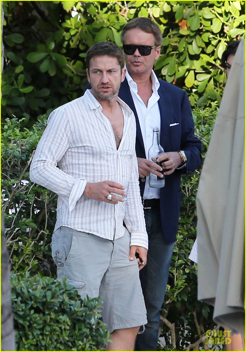 gerard butler relaxes at miami hotel pool with friends 183004341
