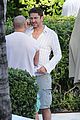 gerard butler relaxes at miami hotel pool with friends 14